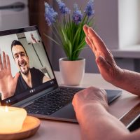 old-woman-communicates-with-her-son-via-video-link-through-laptop